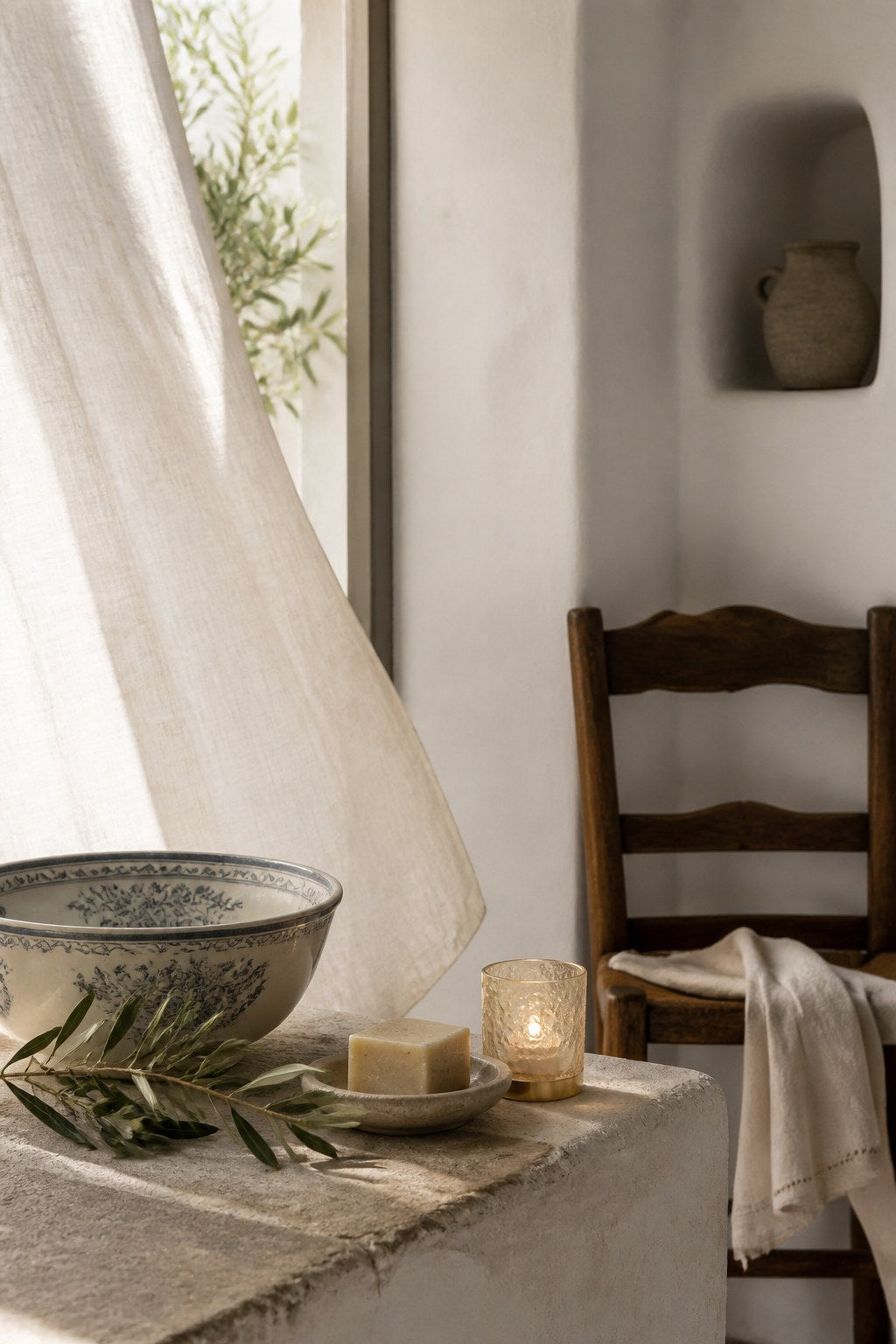 Quiet Sicilian home still life with candle, linen, and ceramics